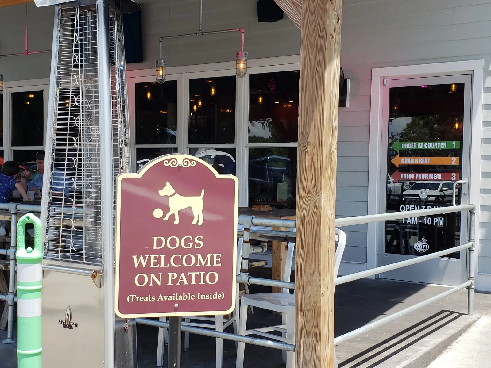 Dogs welcome on our patio sign at NN Burger