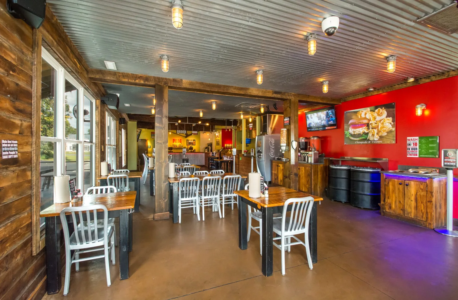 Inside the NN Burger dining room with reclaimed wood tables