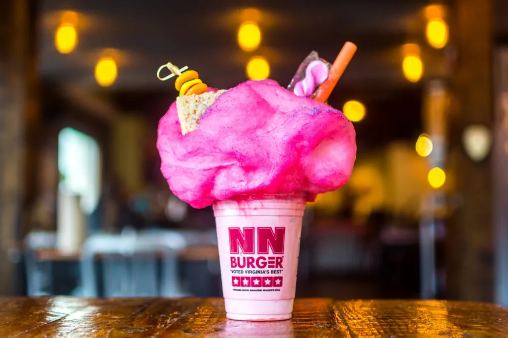 Pink milkshake topped with cotton candy