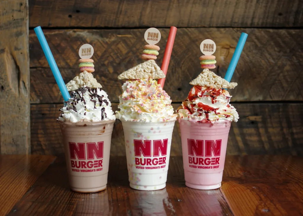 Three milkshakes with specialty toppings